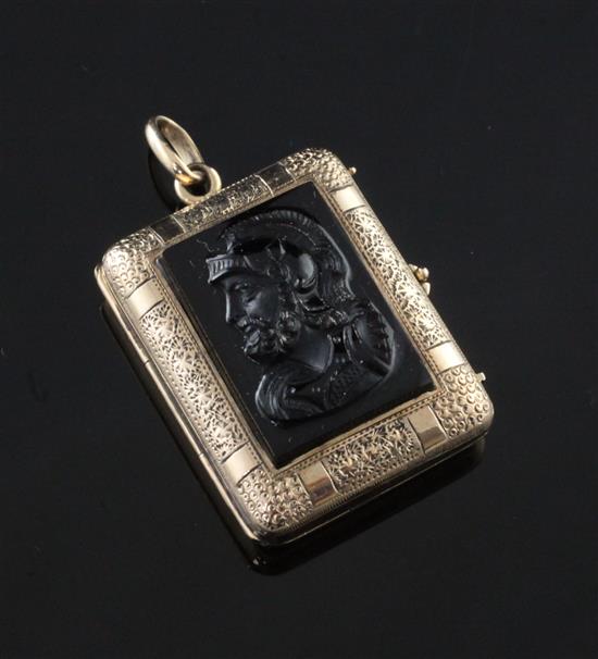 A late Victorian gold and black onyx inset pendant locket, approx. 1in.